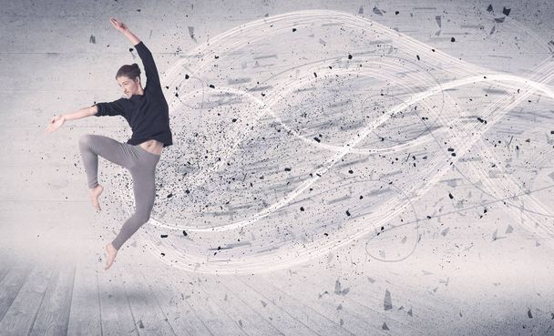 Performance ballet dancer jumping with energy explosion particle - Foto, Imagen
