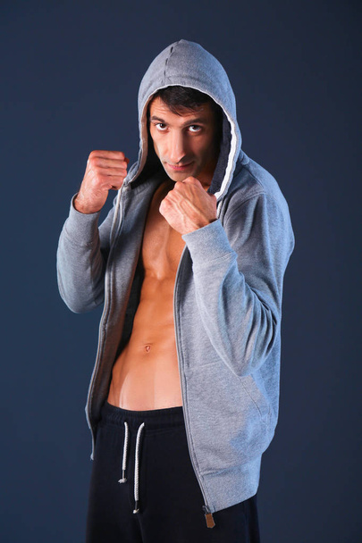 Profile view of young man practicing boxing - Φωτογραφία, εικόνα
