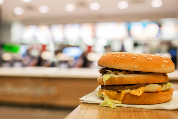 cheeseburger on the table. fast food restaurants. - Fotó, kép