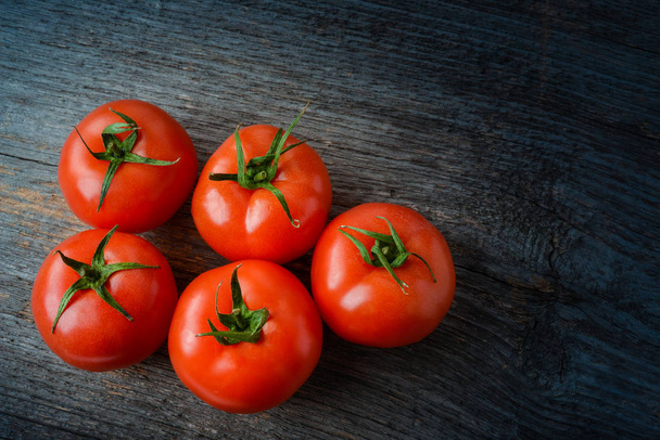 Fresh tomatoes on the table in natural light - Photo, Image