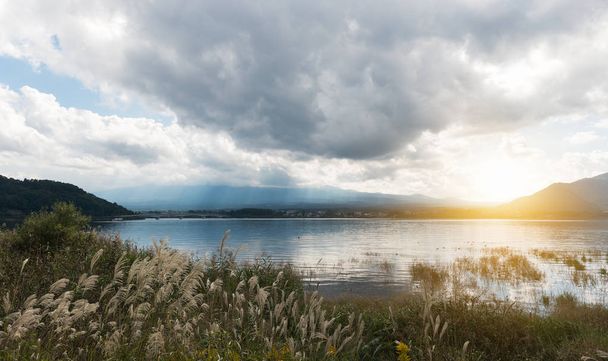 Lake Kawaguchiko with cloudy sky and sunset - Fotó, kép