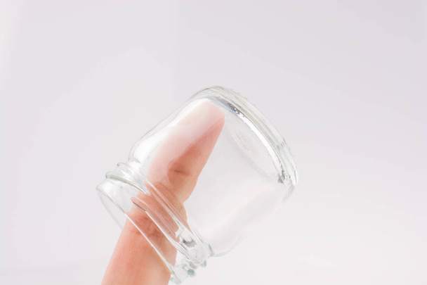 Little empty jar in hand - Foto, imagen