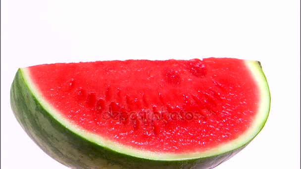 čtvrtletí meloun otočení na bílém pozadí - Záběry, video
