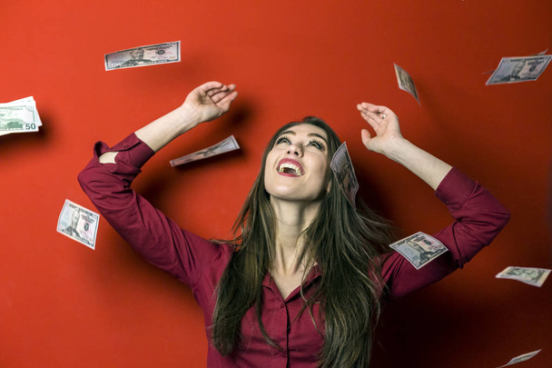 Woman on Falling Banknotes Background - Фото, изображение