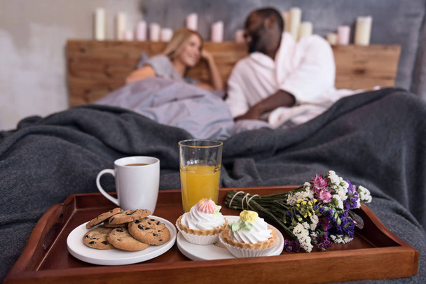 Big breakfast tray standing in bedroom - Фото, зображення