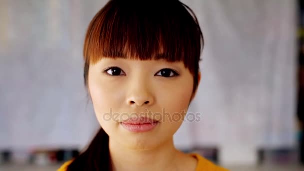 face of happy smiling asian young woman - Video