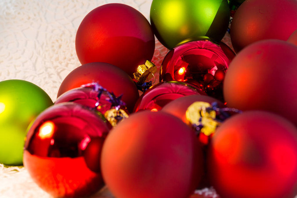 Christmas red and green balls, Christmas tree closeup - Фото, зображення