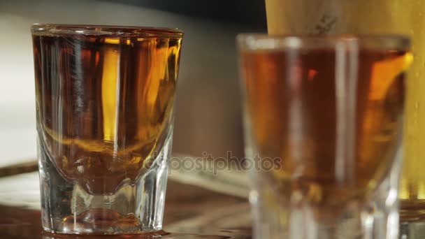 close up on two shots of whiskey clean shot - Footage, Video