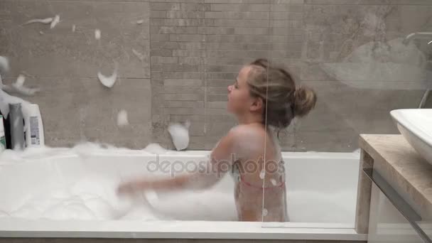 Little girl playing with foam - Кадри, відео
