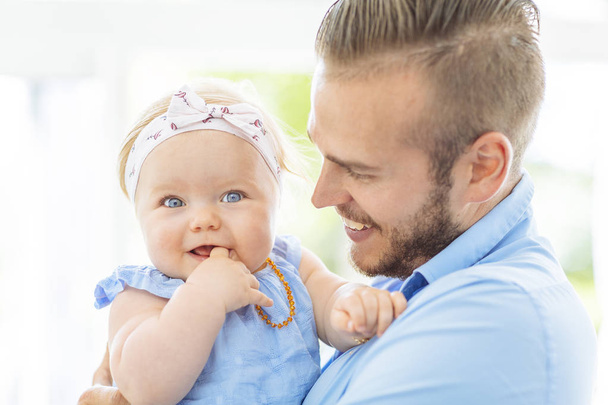 Portrait of a baby girl with her dad - Foto, afbeelding