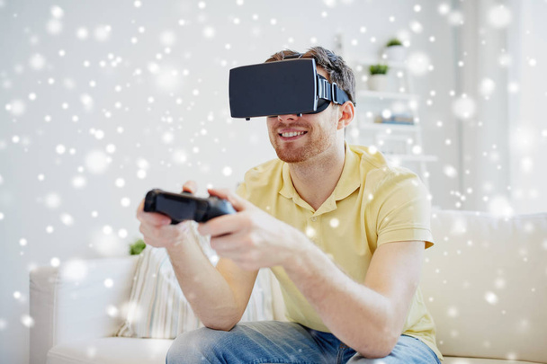 man in virtual reality headset with controller - Φωτογραφία, εικόνα