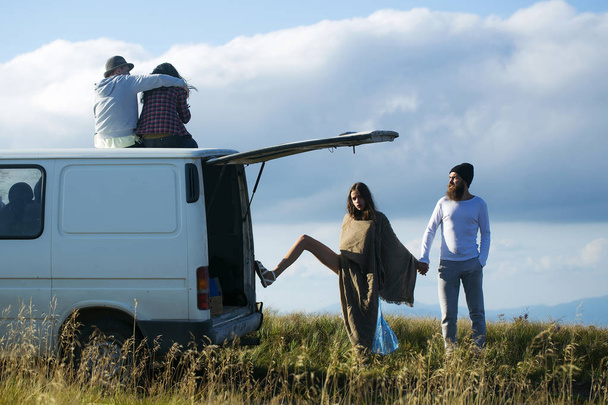 Young couples travel by minibus - Φωτογραφία, εικόνα