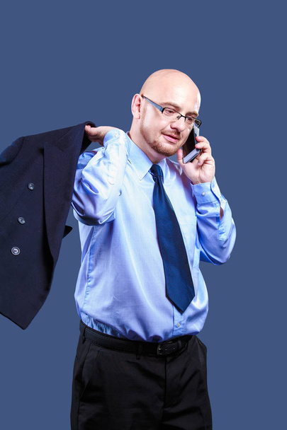 Bold headed guy with glasses making a phone call  - Photo, Image