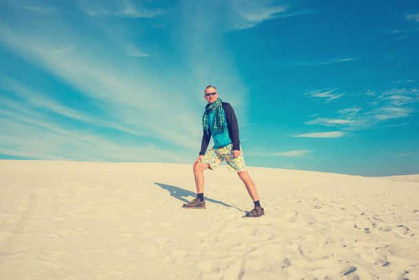 Smiling man hike walking in the desert - Фото, изображение