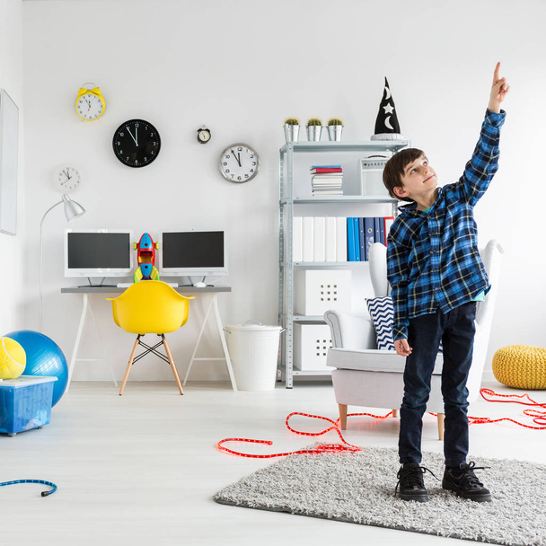 Boy is standing in his room - Photo, image