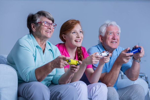 Senior people playing video games - Foto, Bild