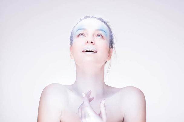 Model in creative image with silver blue artistic make-up - Fotografie, Obrázek