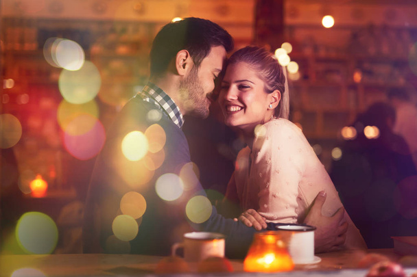 Romantic couple dating in pub - 写真・画像