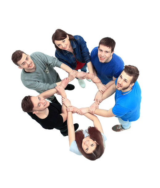 Top view of young people with their hands together in a circle. - Fotografie, Obrázek