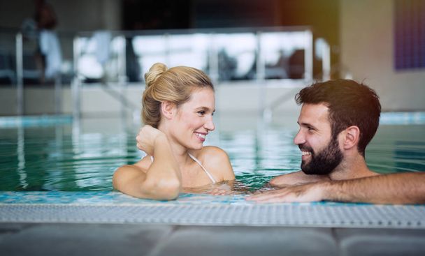 Romantic couple enjoying thermal bath - Фото, изображение