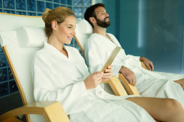 Couple enjoying spa treatments and relaxing - Фото, изображение