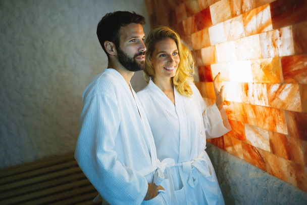 Couple enjoying salt spa treatment - Фото, зображення