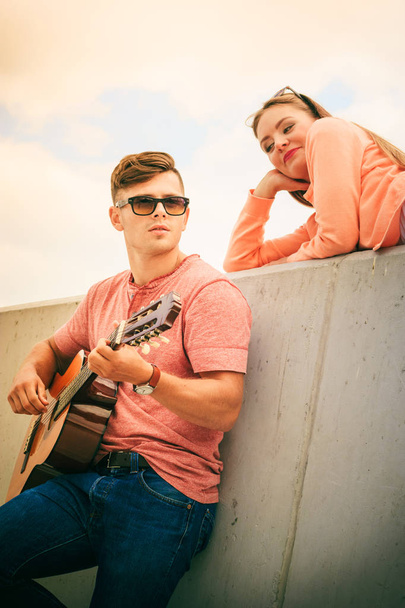 Happy couple with guitar outdoor - Zdjęcie, obraz