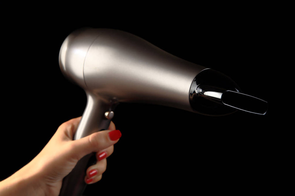 Hair dryer in  female hand - Photo, Image
