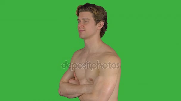 Muscular man with arms crossed (Green Key) - Footage, Video