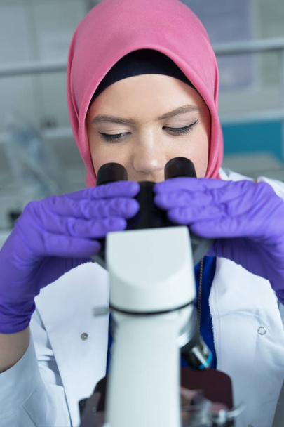 muslim lab worker with hijab  - Фото, изображение