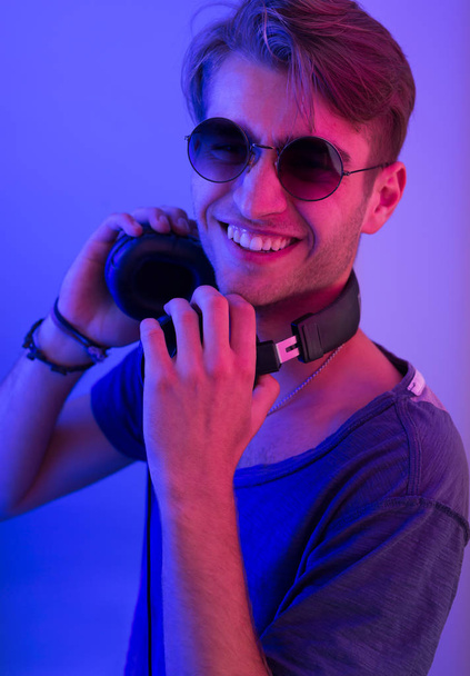 dj with headphones in nightclub - Foto, imagen
