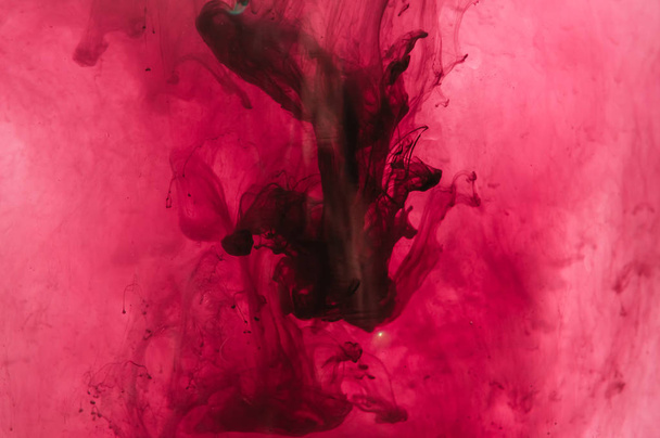 Red, pink, black, white ink in water. Sunshine lighting. Dynamic - Foto, immagini