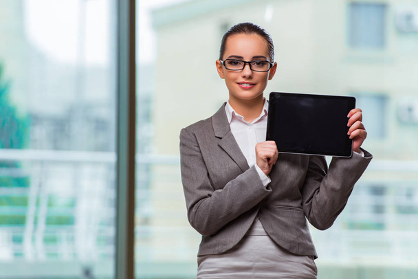 Woman working with tablet in office - Photo, Image