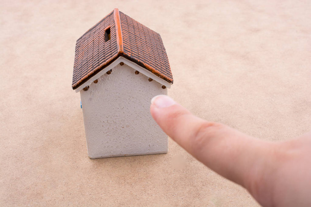 Little model house and  a hand  - Photo, Image