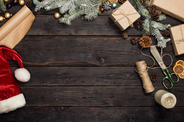 Christmas objects on dark wooden table with copy space - Fotoğraf, Görsel