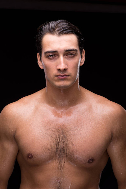 Ripped muscular handsome man on black background - Foto, Imagem