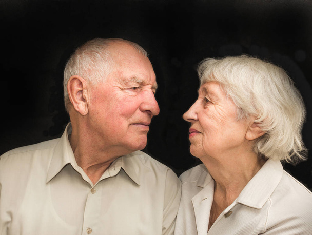 The elderly couple on a black background - 写真・画像