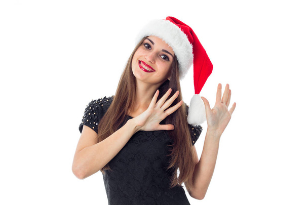 cheerful brunette girl in santa hat - Photo, image