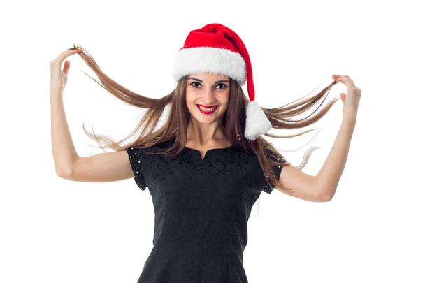girl in santa hat smiling - Фото, изображение
