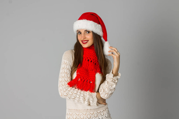 girl in santa hat and red scarf - Fotó, kép