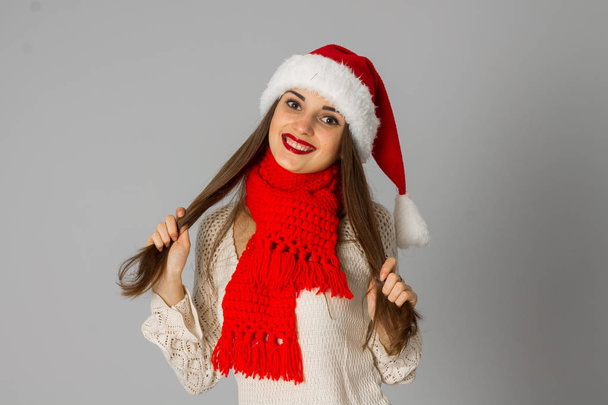 girl in santa hat and red scarf - Zdjęcie, obraz