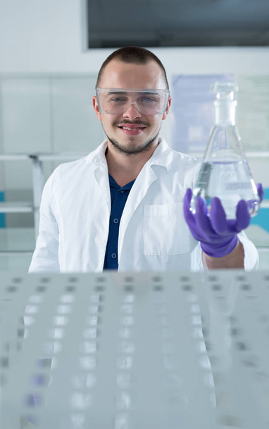Cheerful young researcher - Foto, Bild