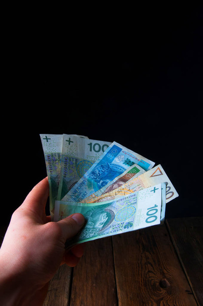Polish banknotes in hand - 写真・画像