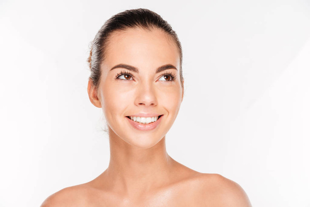 Beauty portrait of a happy woman with skincare standing - Foto, Imagem