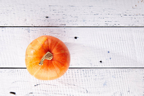 Pumpkin on Wooden Background Top View - Фото, изображение