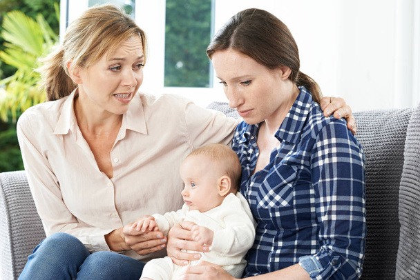 Mother Comforting Adult Daughter Suffering With Post Natal Depre - Photo, image