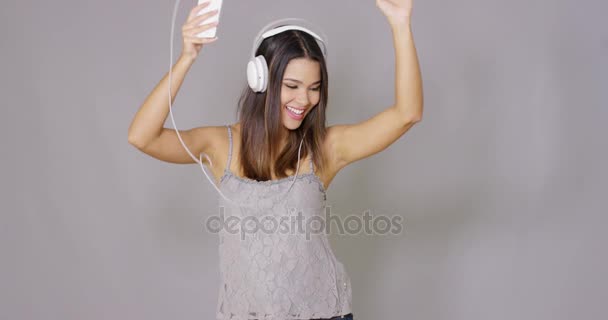 Rapturous young woman listening to music - Felvétel, videó