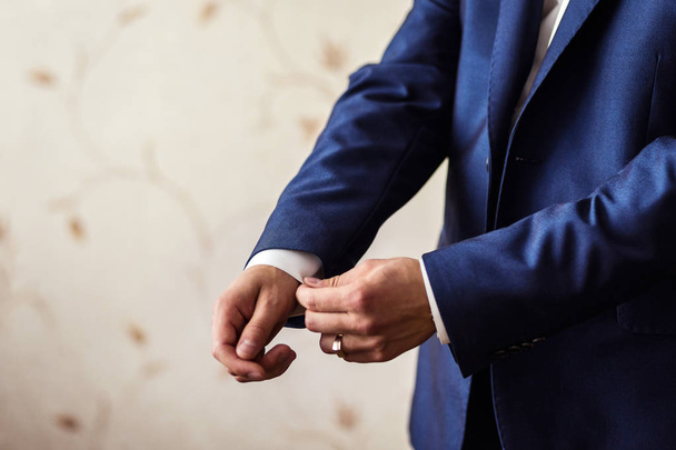 Businessman wears a jacket.Politician, man's style,male hands closeup, American, European businessman, business, fashion and clothing concept - Photo, Image