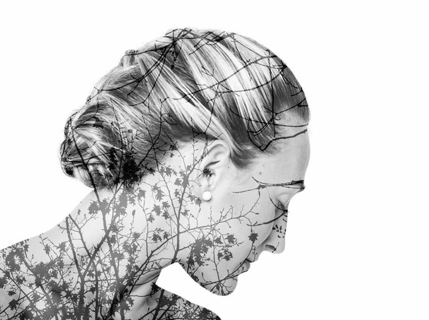Monochrome double exposure of girl with beautiful hairdo and branches - Photo, Image
