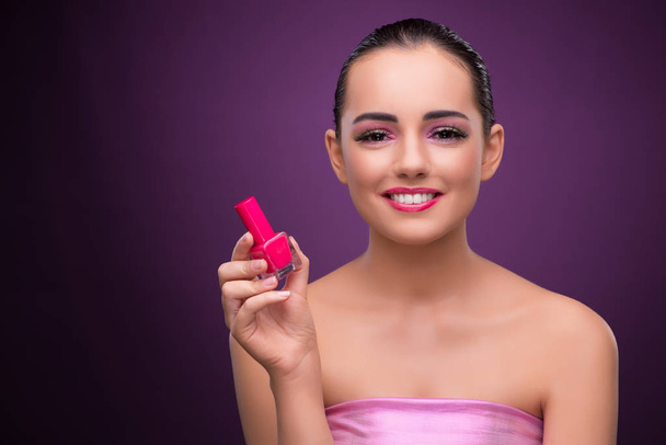 Woman with lipstick tube in beauty concept - Valokuva, kuva